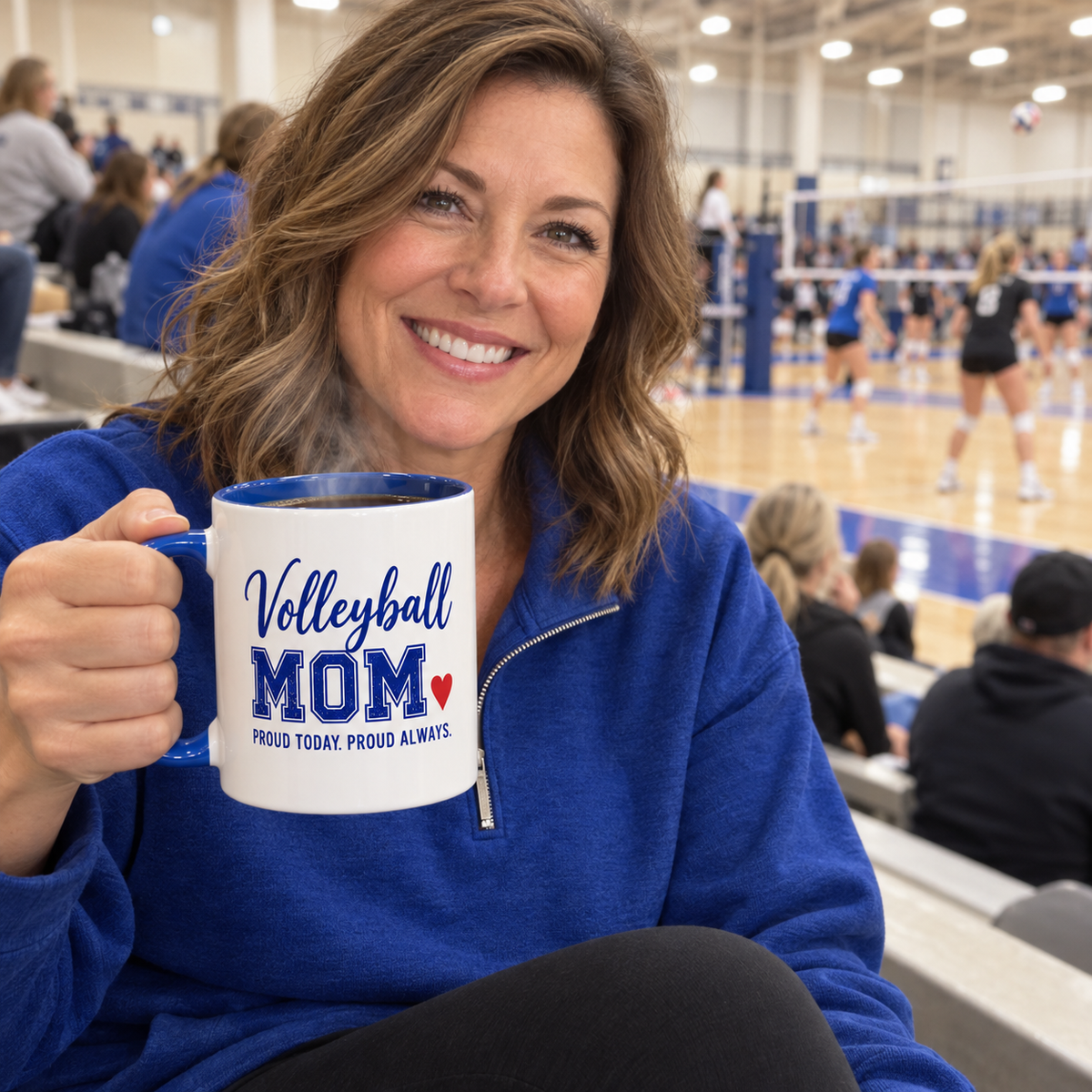 Volleyball mom at the game holding a personalized Volleyball Mom mug