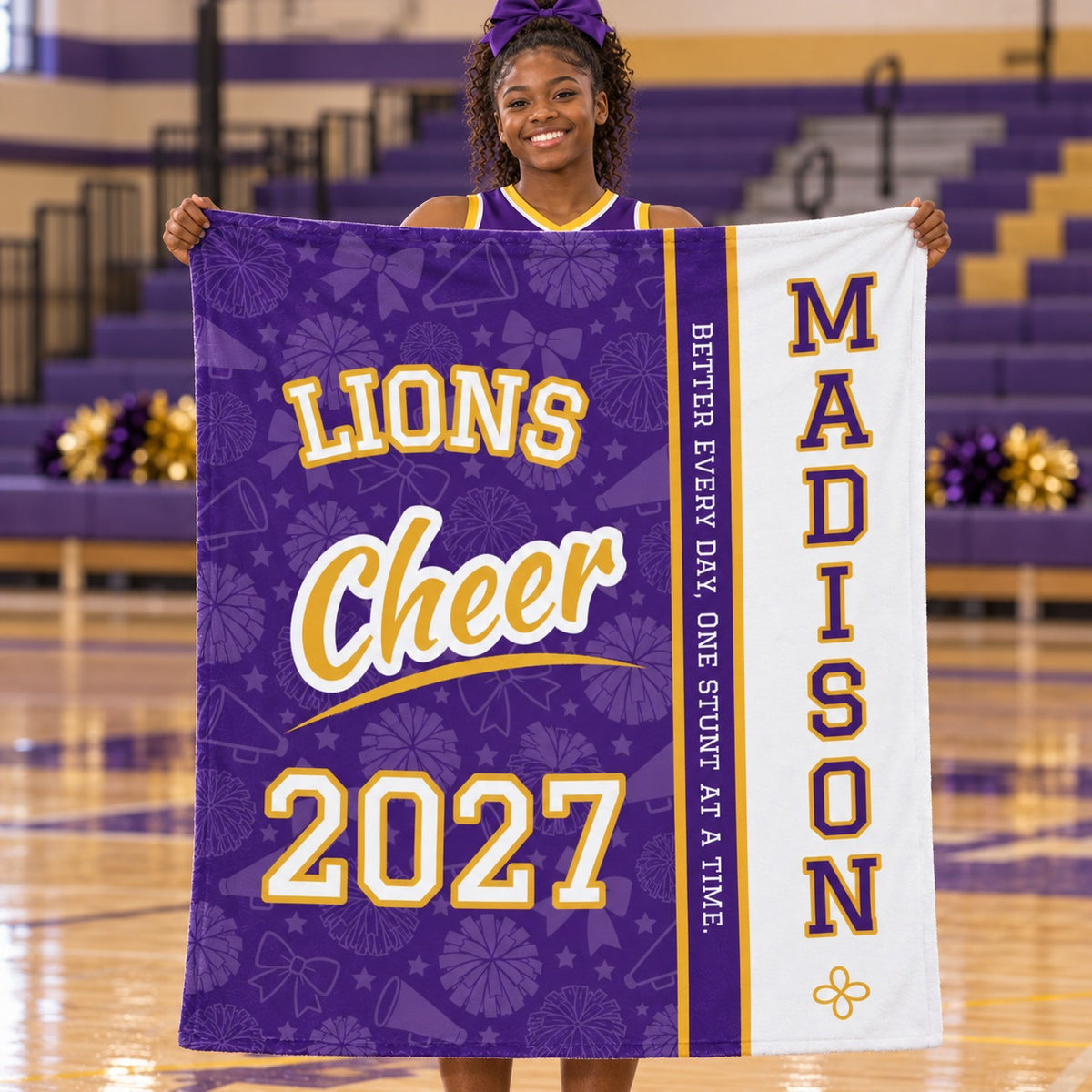 Personalized cheer blanket varsity split design held by a cheerleader in the gym