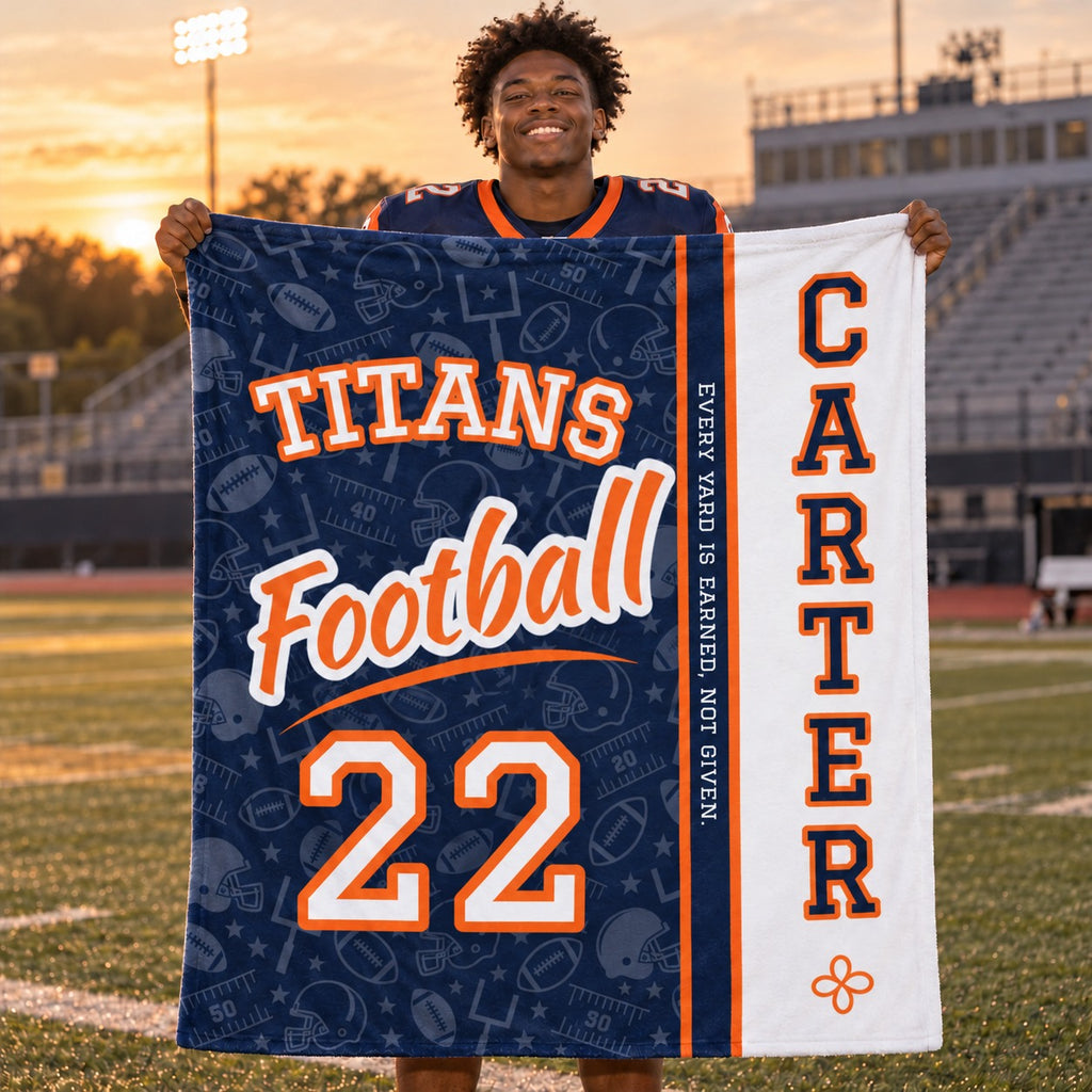 Personalized football blanket varsity split design held by a player on the field