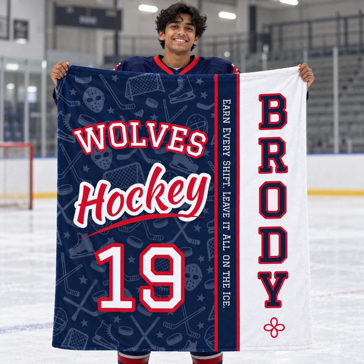 Personalized hockey blanket varsity split design held by a player on the ice