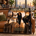 Lead Like a CEO motivational quote blanket on a leather sofa in an executive office