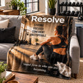 Resolve motivational quote blanket draped over a sofa