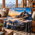Strength motivational quote blanket draped over a sofa