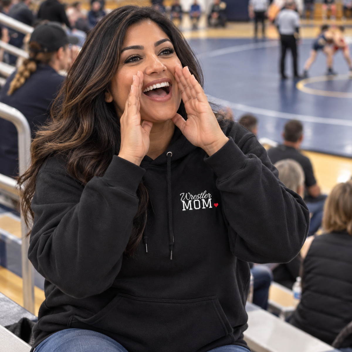 Wrestling mom wearing the personalized jersey hoodie