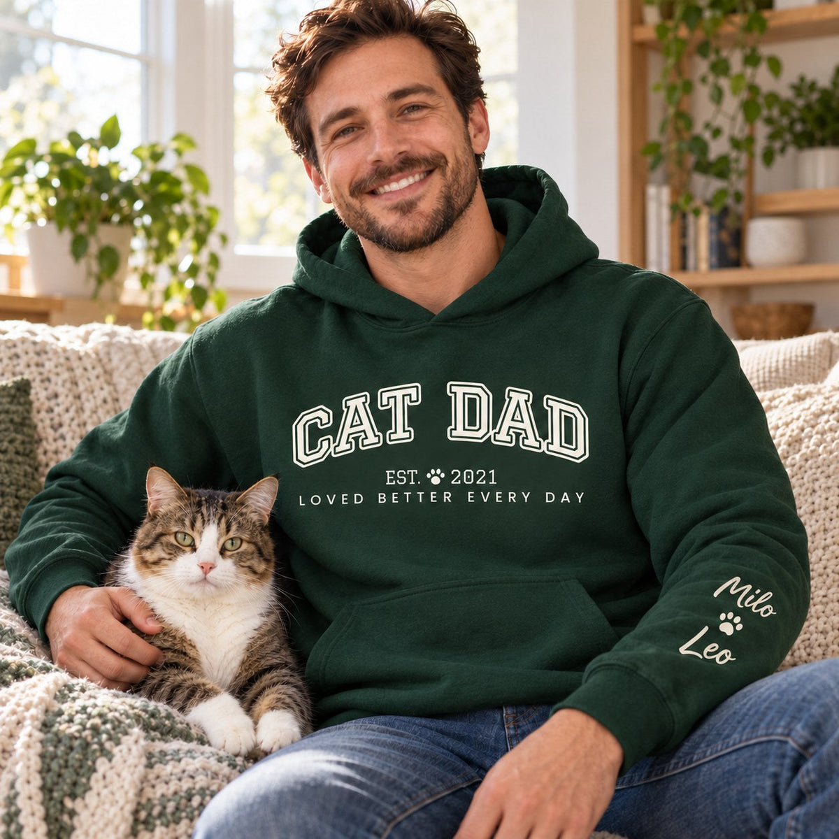 Personalized Cat Dad Hoodie - lifestyle photo with pet names on the sleeve
