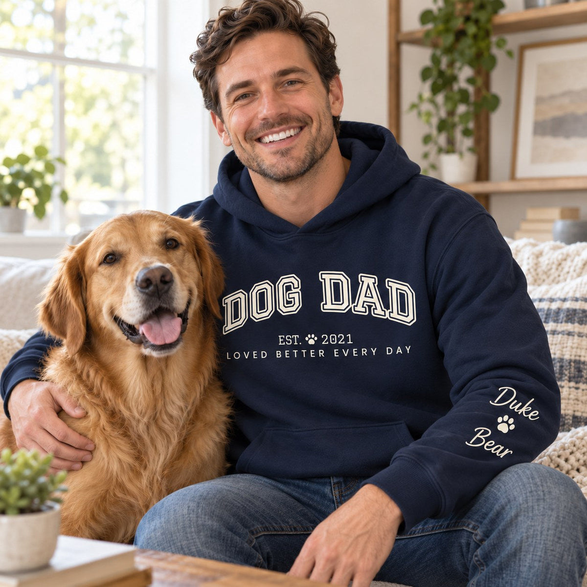 Personalized Dog Dad Hoodie - lifestyle photo with pet names on the sleeve