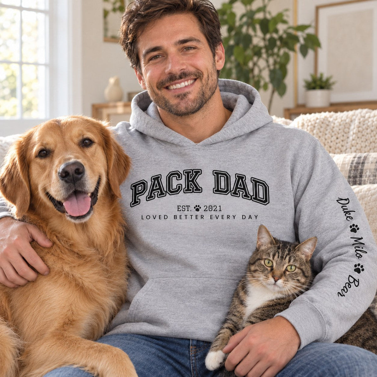 Personalized Pack Dad Hoodie - lifestyle photo with pet names on the sleeve