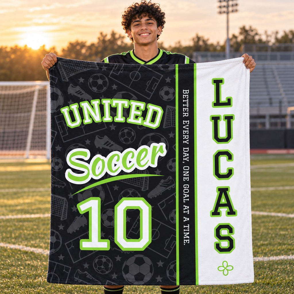 Personalized soccer blanket varsity split design held by a player on the field