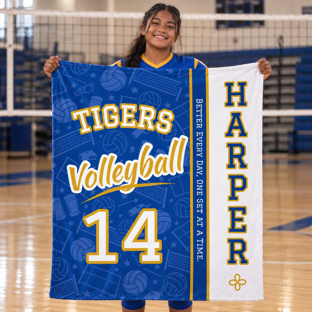 Personalized volleyball blanket varsity split design held by a player on the court