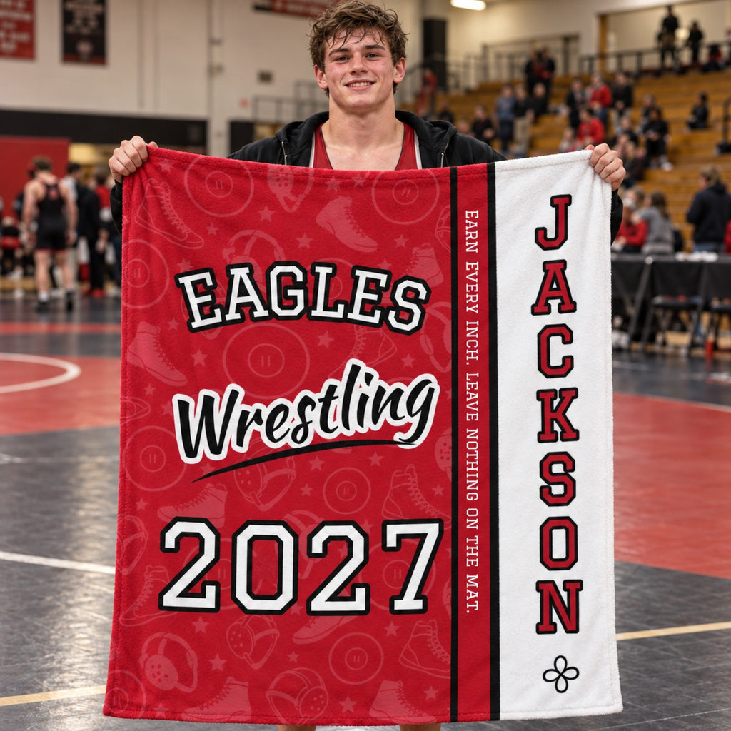 Personalized wrestling blanket varsity split design held by a wrestler in the gym