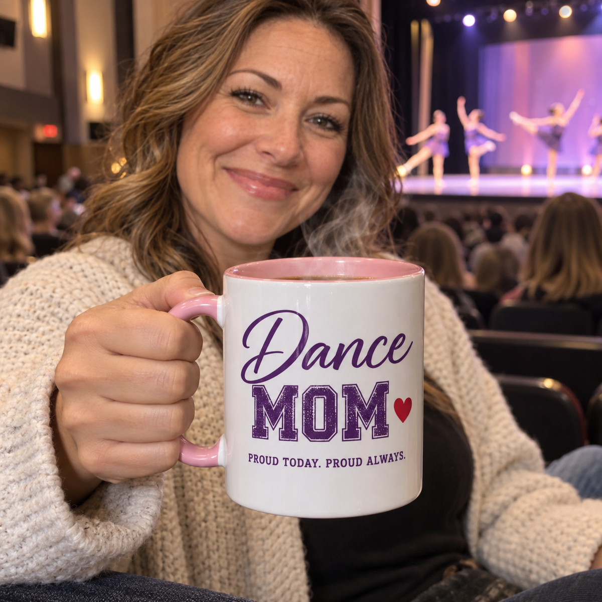 Dance mom at a dance competition holding a personalized Dance Mom mug