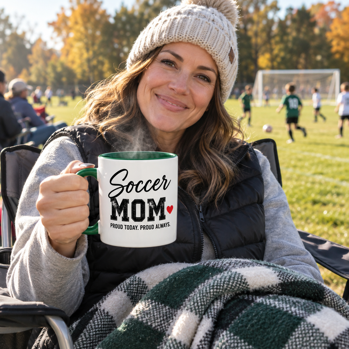 Soccer mom at the game holding a personalized Soccer Mom mug
