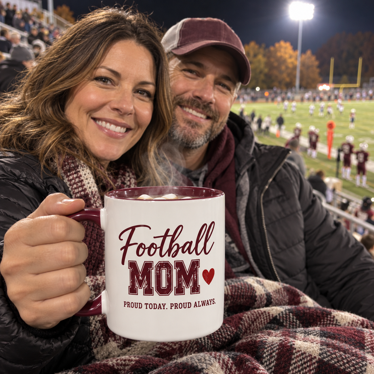 Football mom at the game holding a personalized Football Mom mug